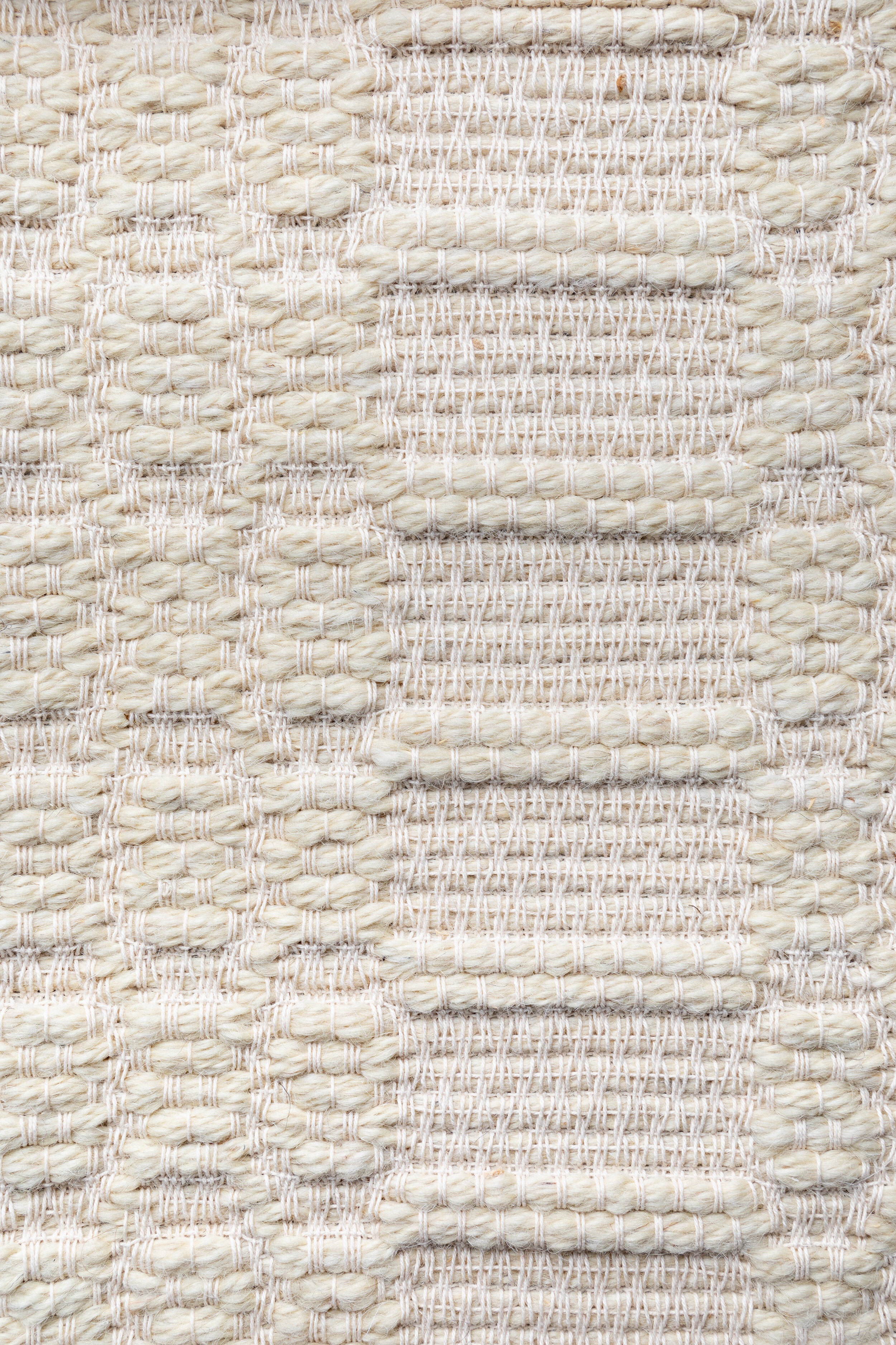"Pinto Chiocciolina" rug in Natural White