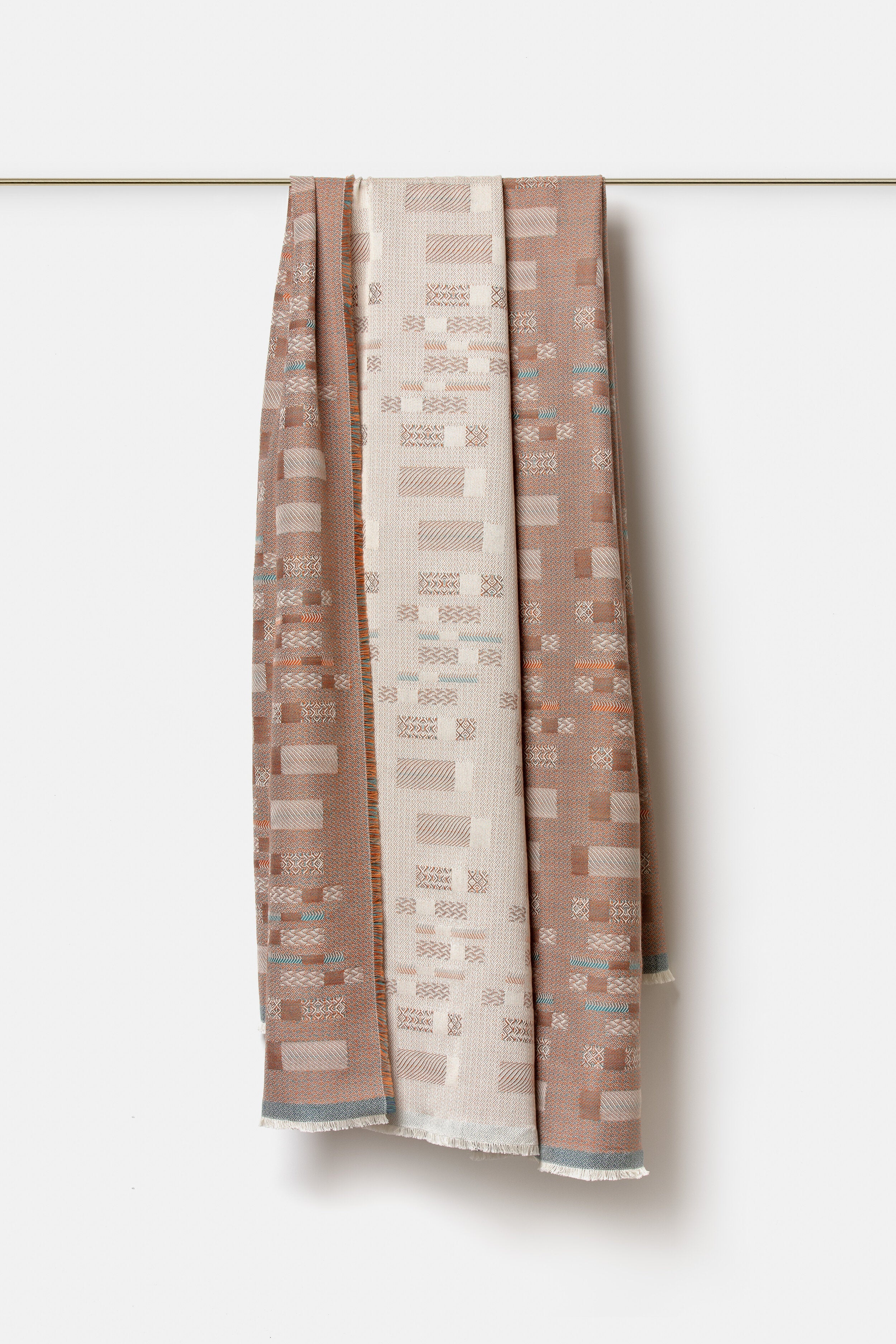 "Aurea" wool throw in Sedona Orange