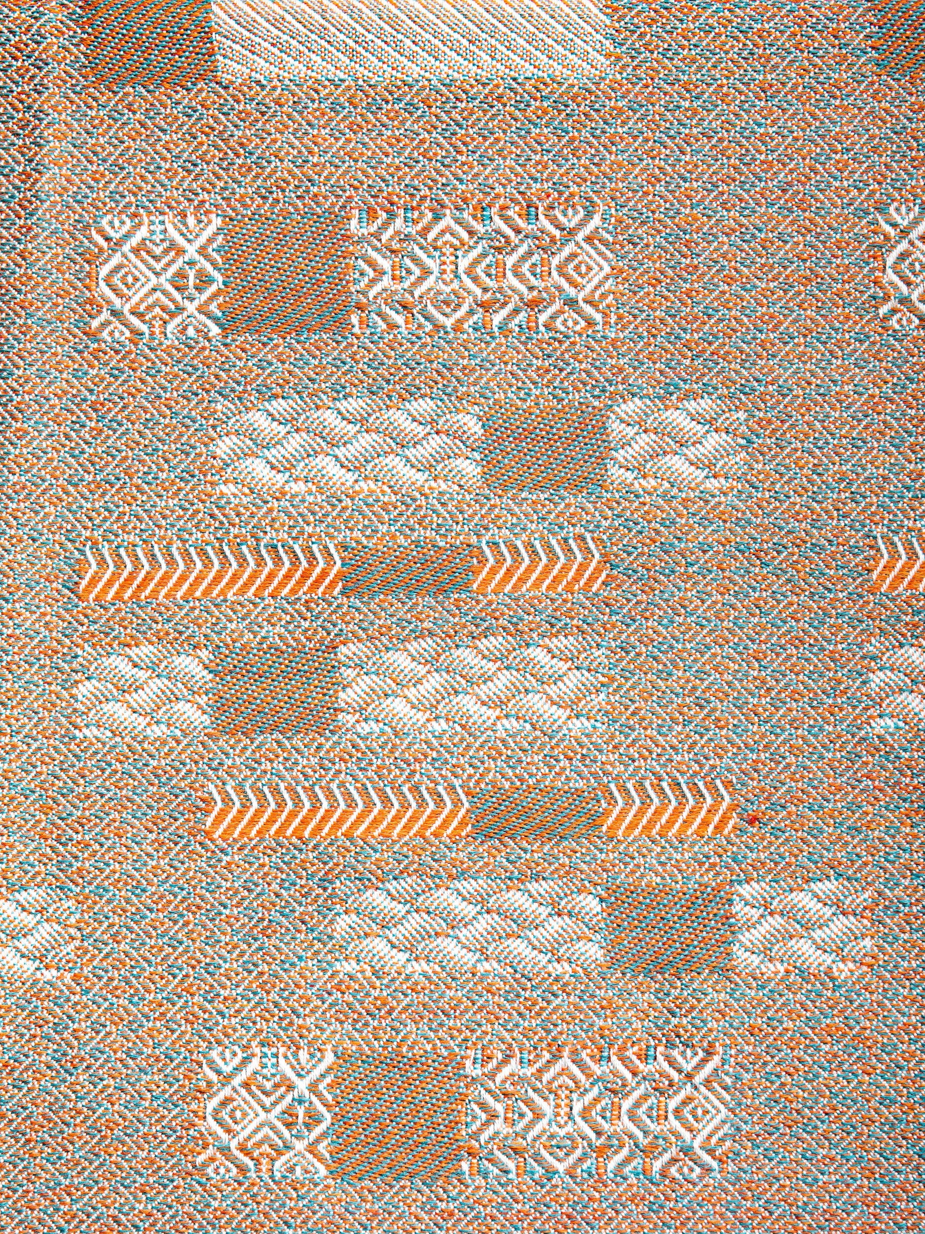 "Aurea" wool throw in Sedona Orange