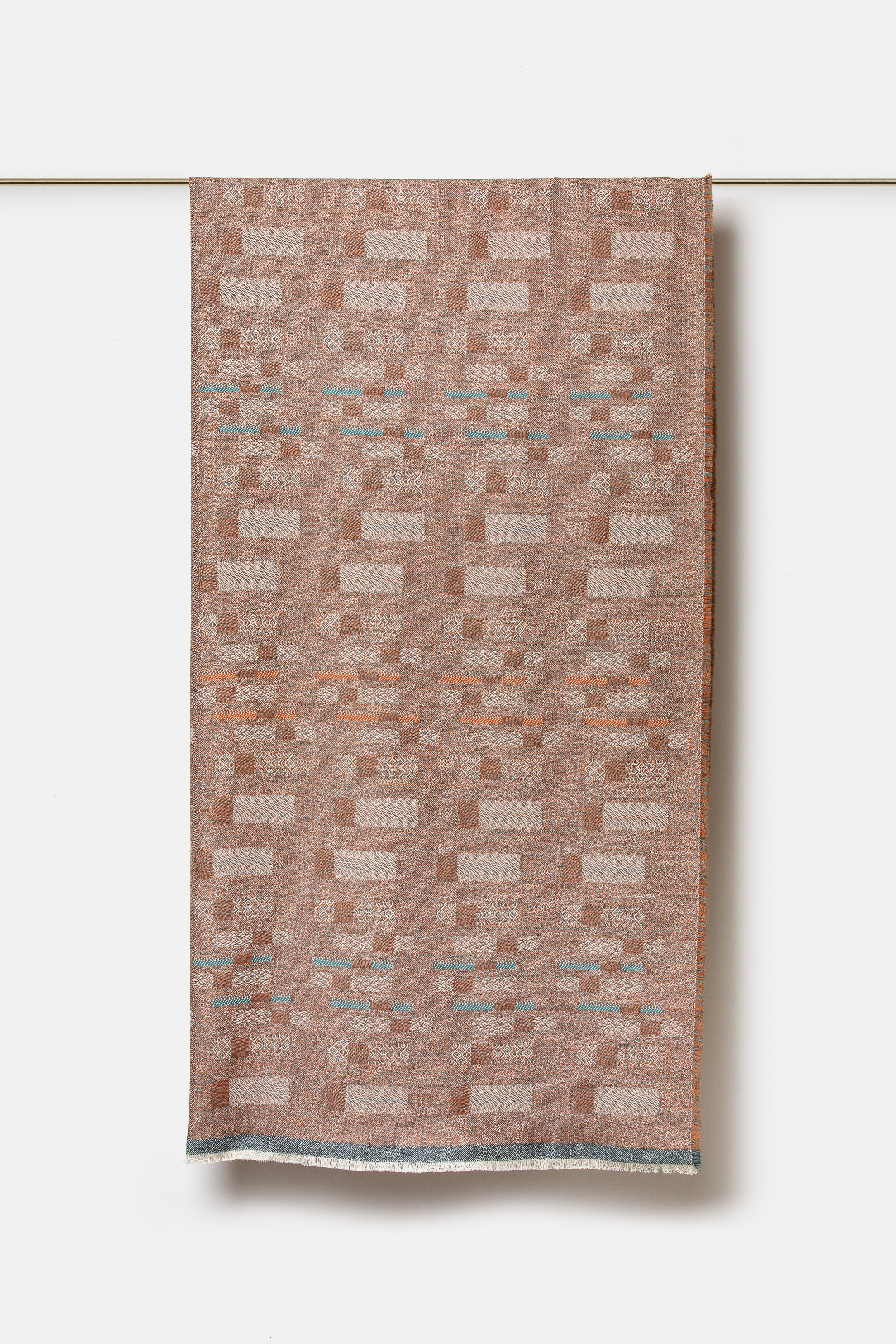 "Aurea" wool throw in Sedona Orange