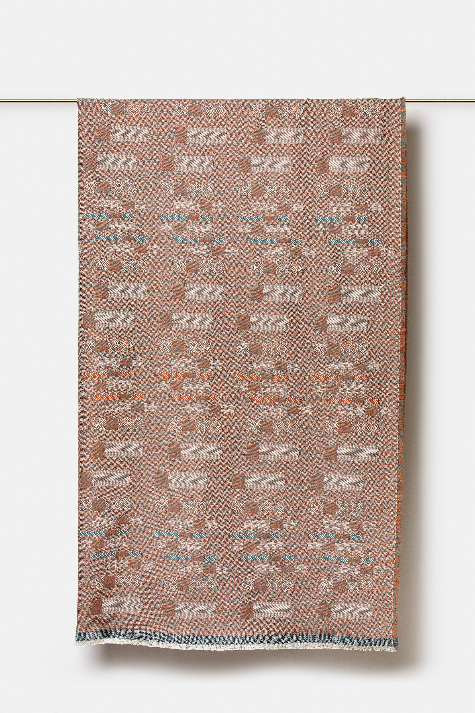 "Aurea" wool throw in Sedona Orange